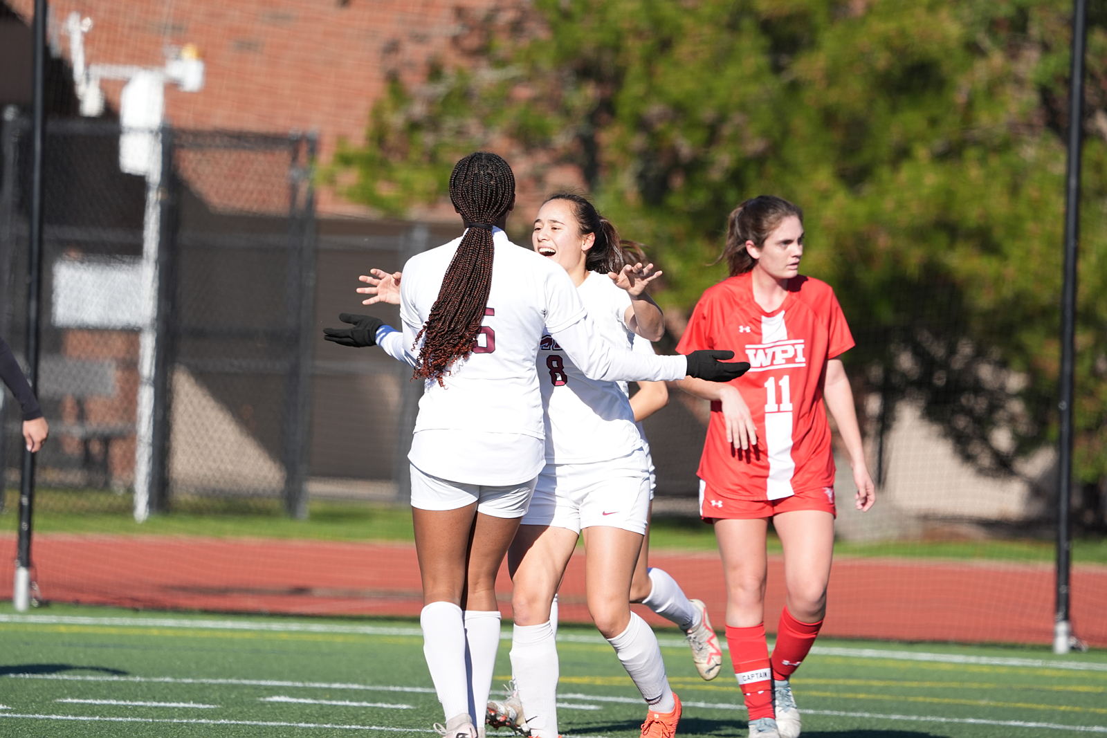 Women's soccer team members on field