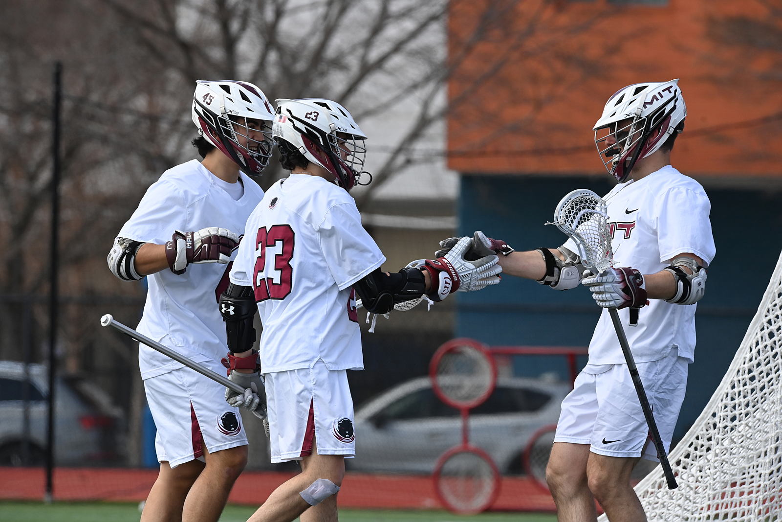 Men's lacrosse players on the field