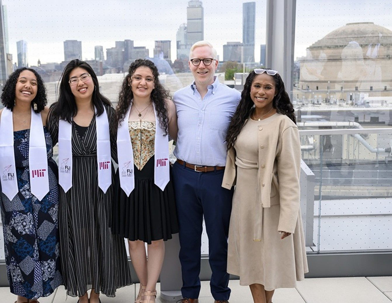 Students stand with President Kornbluth