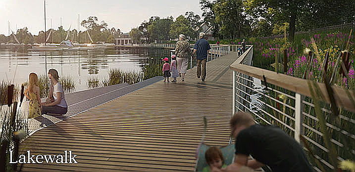 A group of people walking on a boardwalkDescription automatically generated