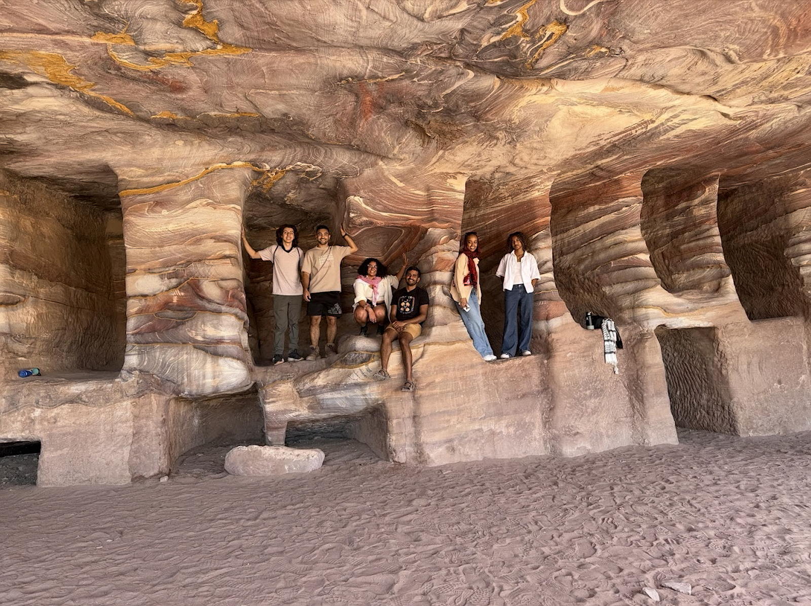 Group of people sitting in front of a National Innovation Center