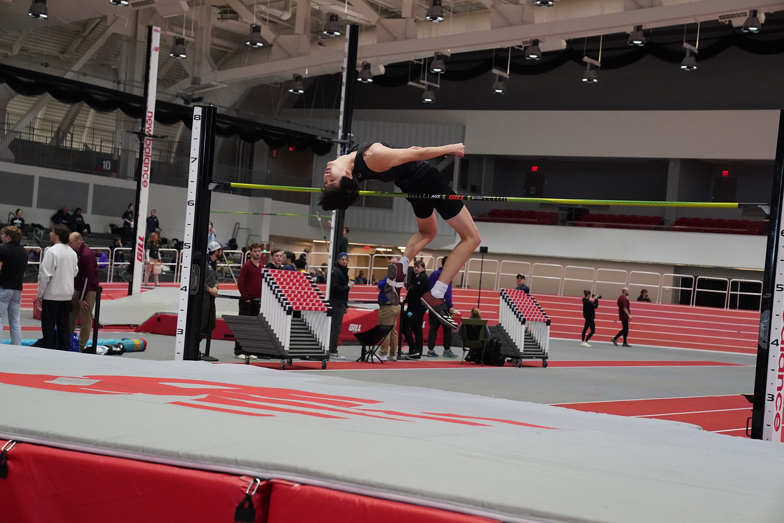 Athlete jumps over bar