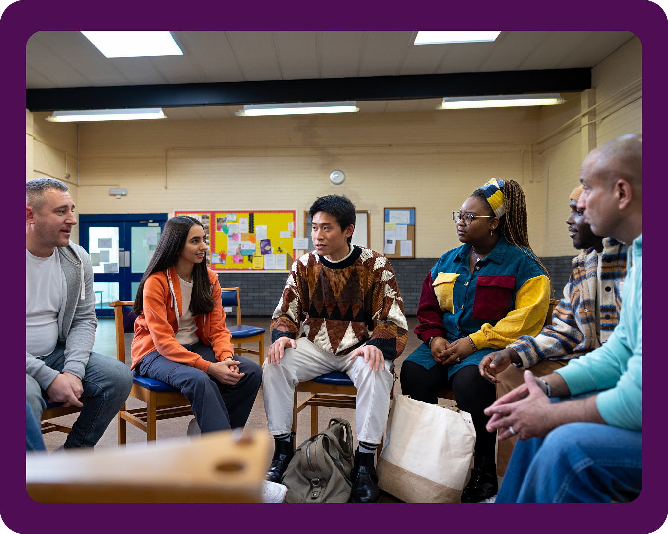 A diverse group of community members collaborate to find a solution