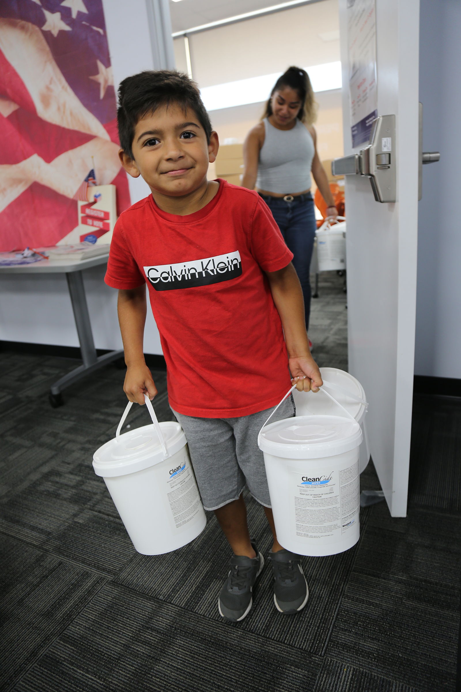 My son, Daniel (6) working as a volunteer in one of our distributions.