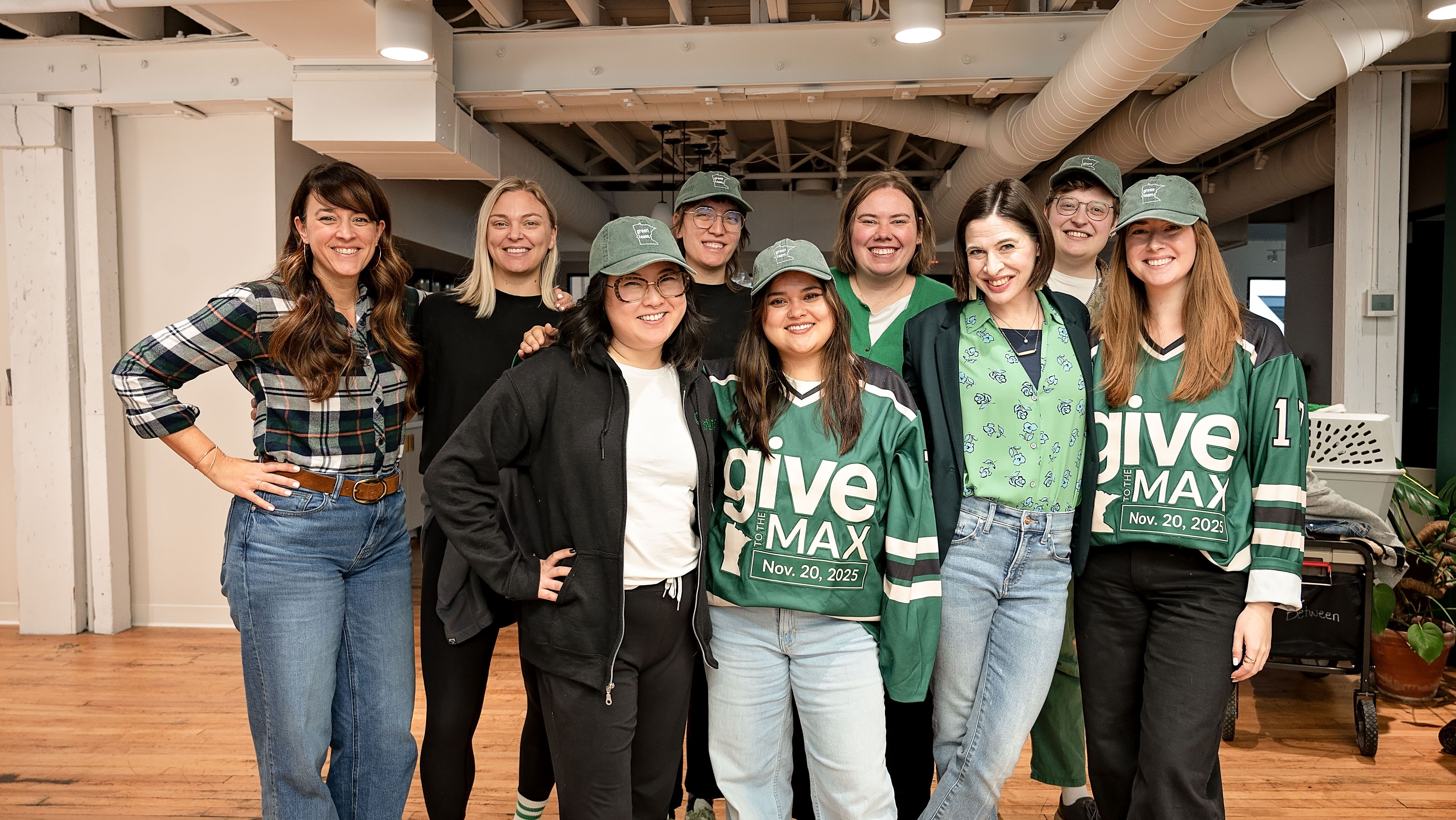 The GiveMN team standing together and smiling during GTMD25.