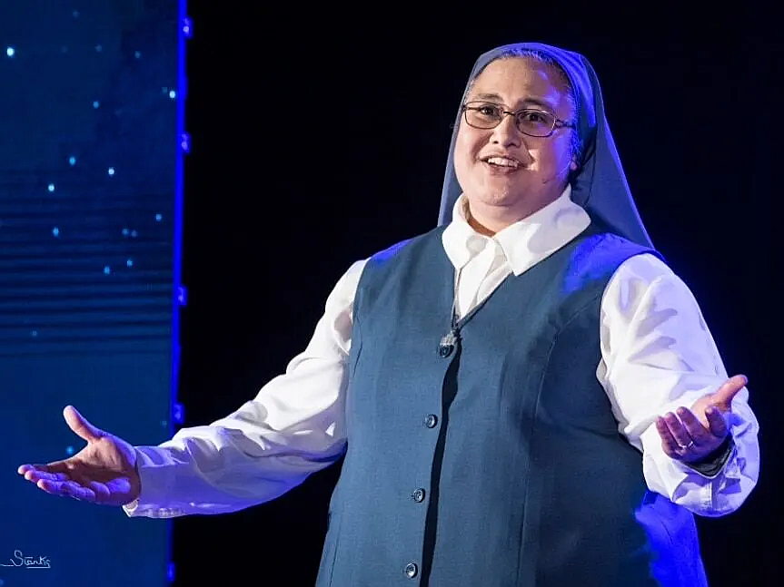 Sister Fay Pele of the Daughters of St. Paul, singing in their Christmas Concert. (This year on December 17 at Jesuit; call the bookstore for tickets.)