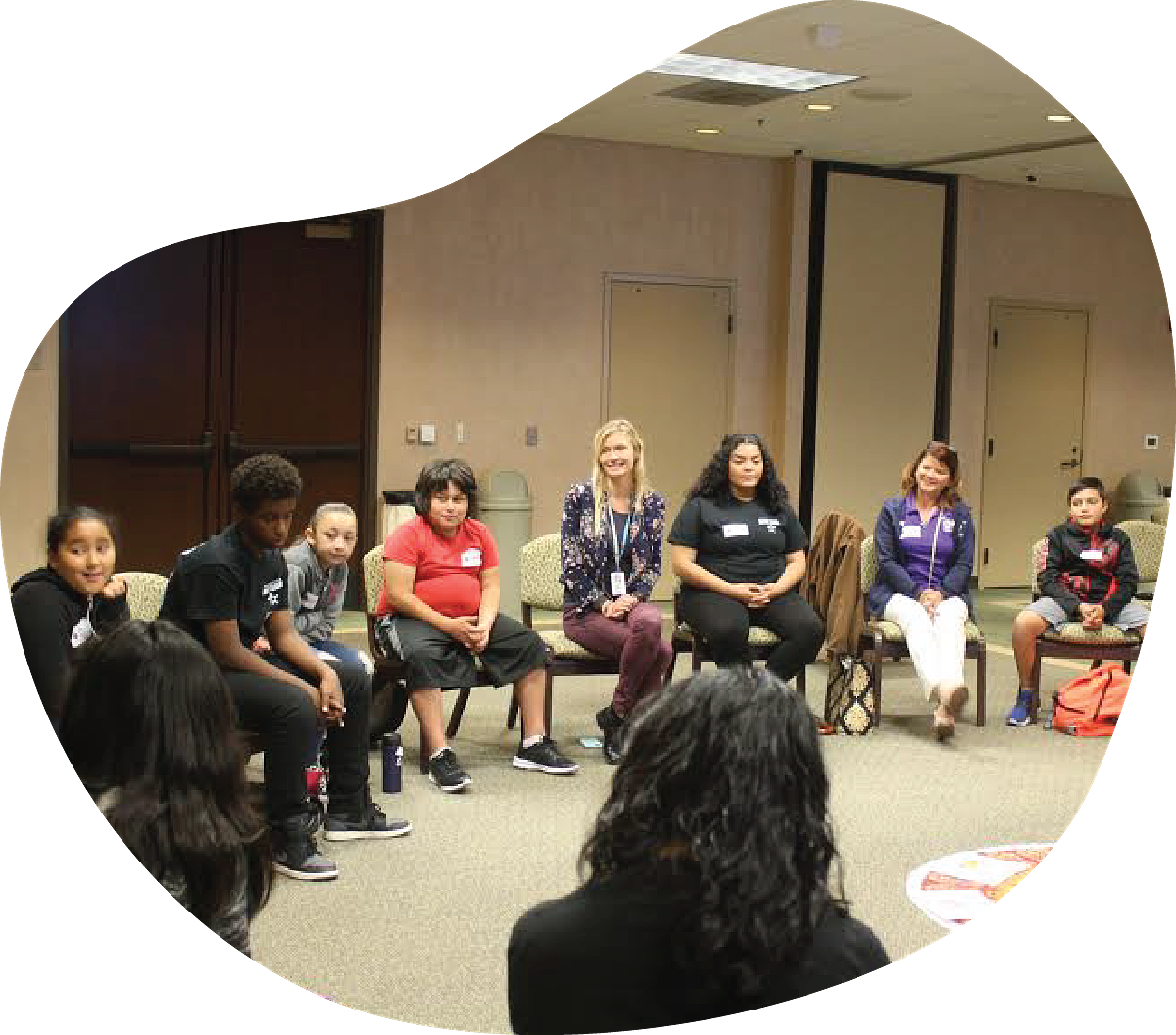 Image depicts youth in a restorative circle