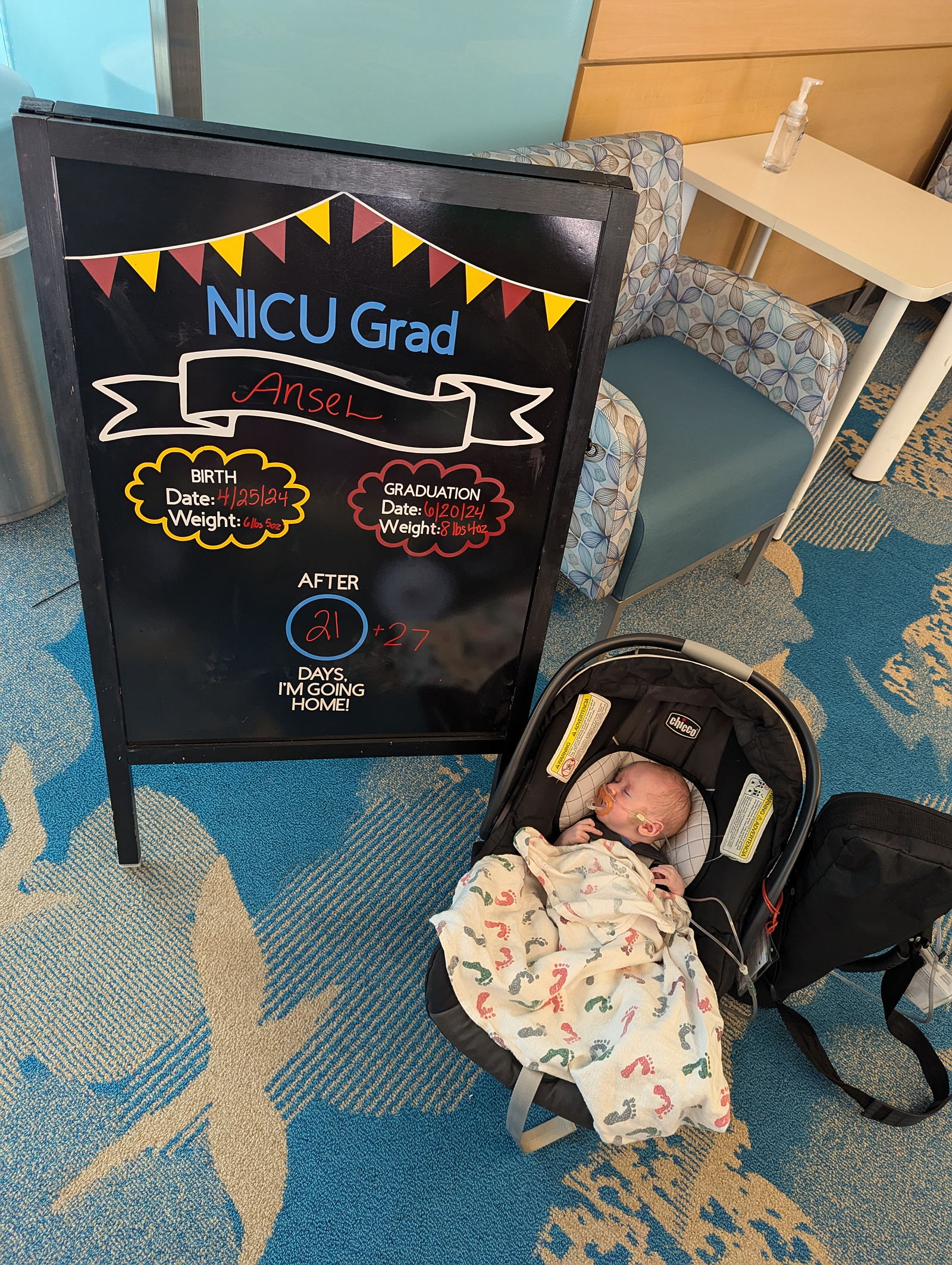 baby and NICU grad sign