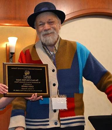 A person holding a plaque