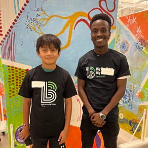 Big Brother Isaac and Little Brother Ethan smiling at Big Brothers Big Sisters Twin Cities