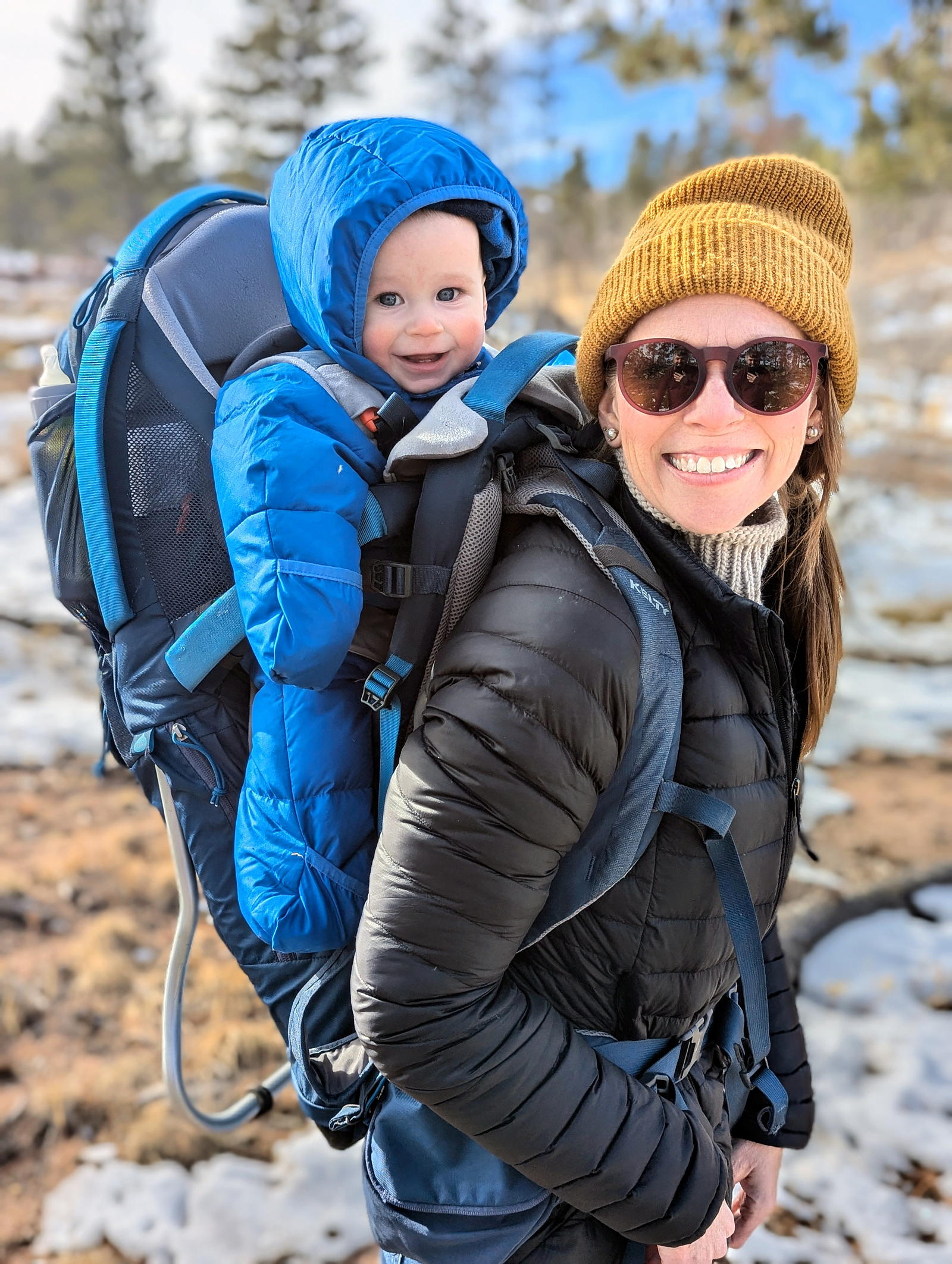 baby on mom's back in a backpack carrier