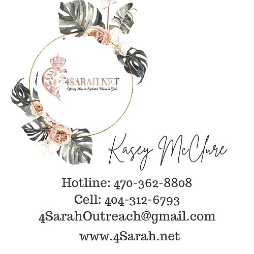 A business card with a gold circle and flowersDescription automatically generated