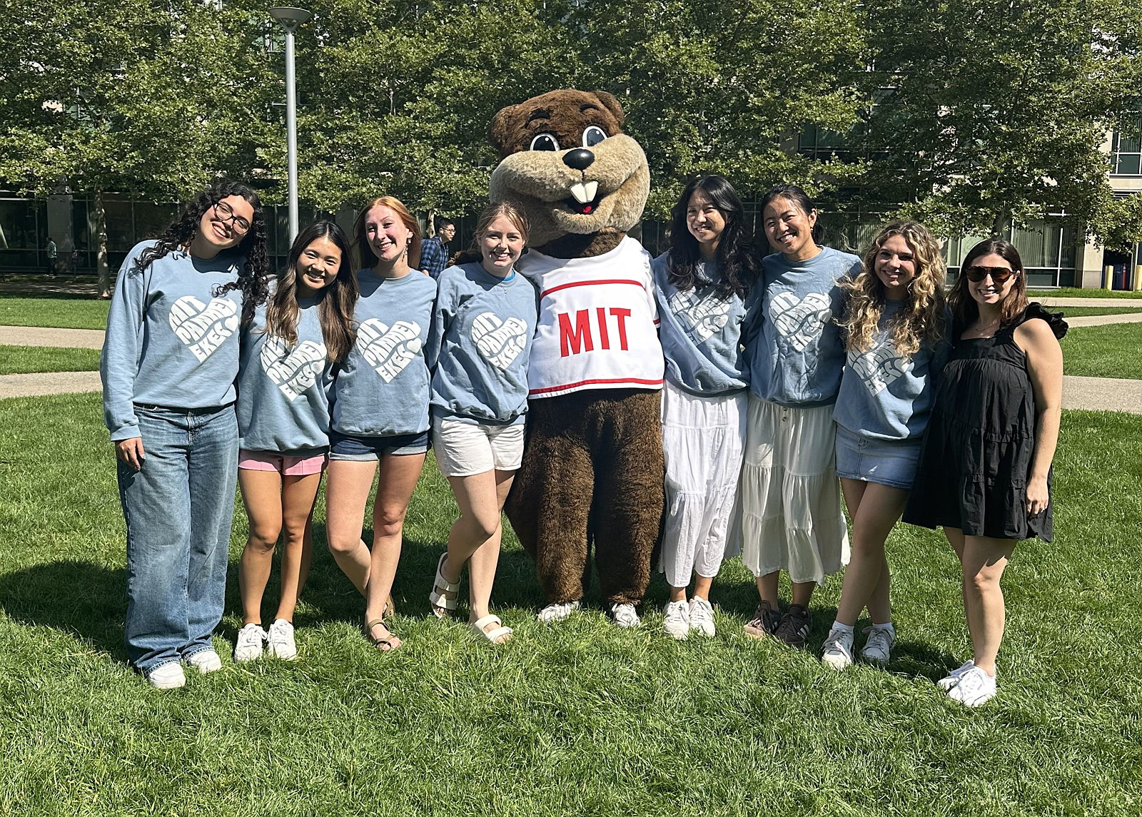 A group poses with Tim the Beaver