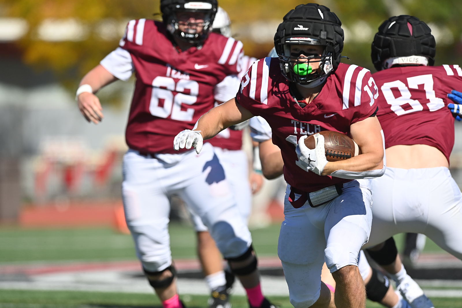 MIT football players on the field