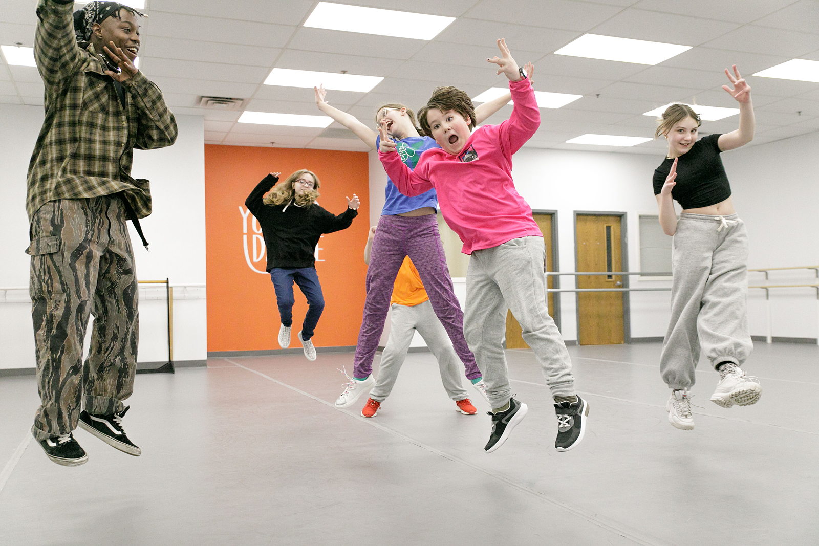 Group of dancers jumping at the Young Dance studios.