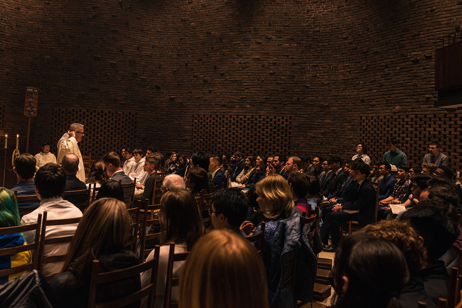 A group watches a church service