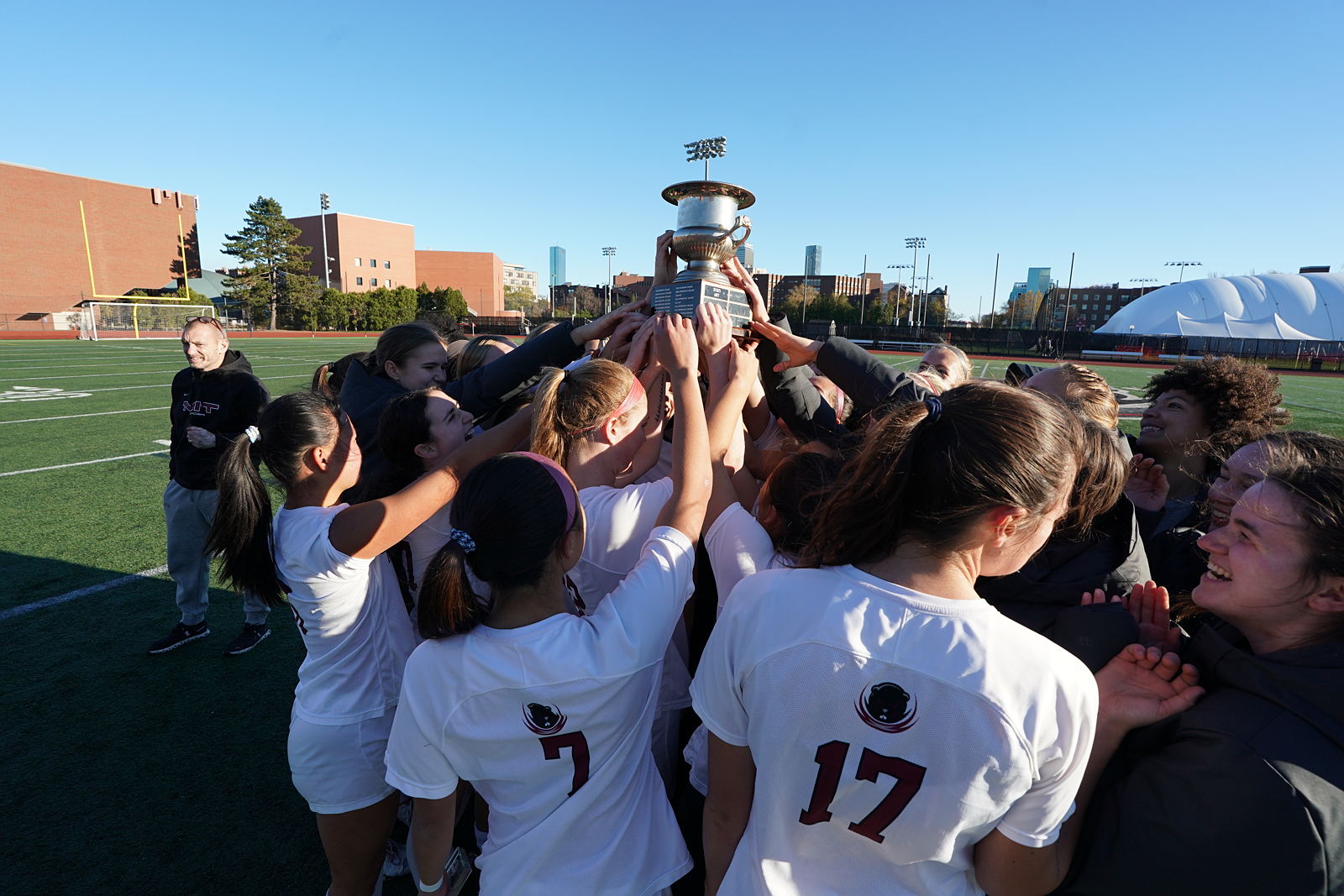 Women's soccer team holds trophy