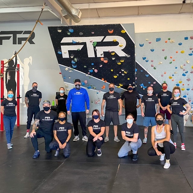FTR Community with masks in gym