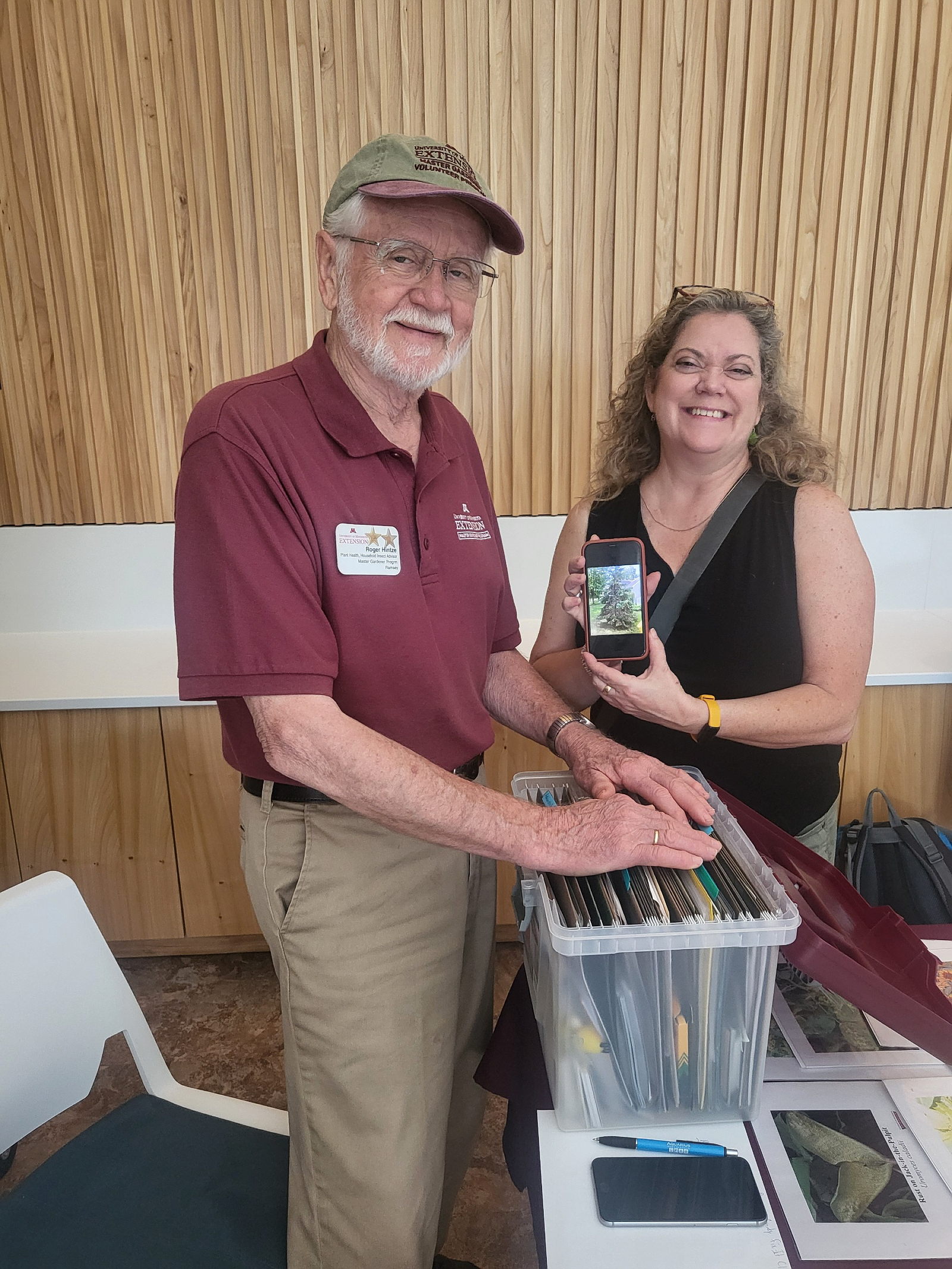 Master Gardener volunteers talking with people
