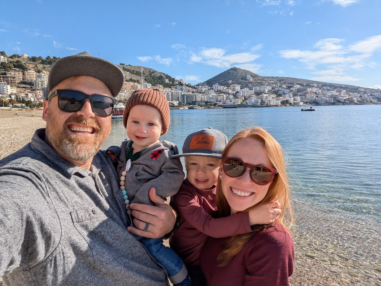 family on posing on a Mediterranean beach
