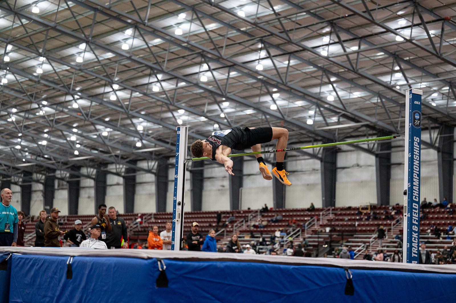 A member of the MIT Track and Field team does a high jump